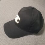 stylish Celine black hat featuring the iconic C logo.